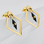 Yellow gold diamond shaped earrings with black centre