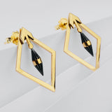 Yellow gold diamond shaped earrings with black centre
