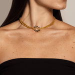 Woman with solid yellow gold choker necklace with edgy spike pendant, plated with Rhodium