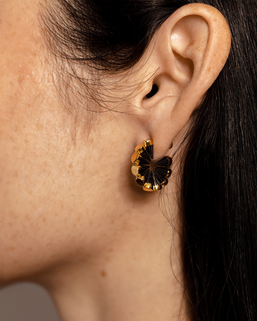 Solid yellow gold earrings with edgy spikes that form a circle